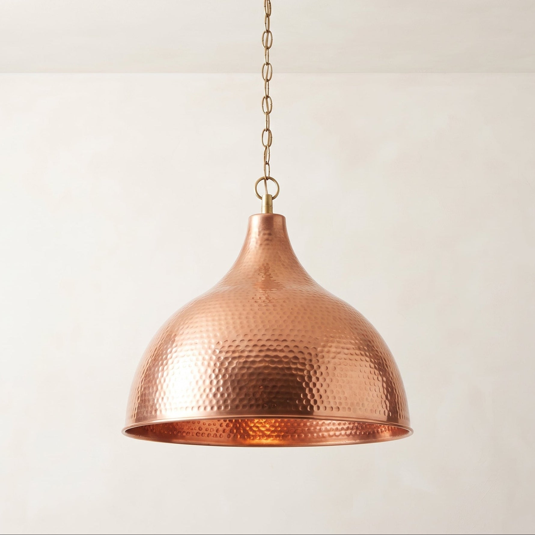 Hammered copper bell pendant light with warm natural copper finish