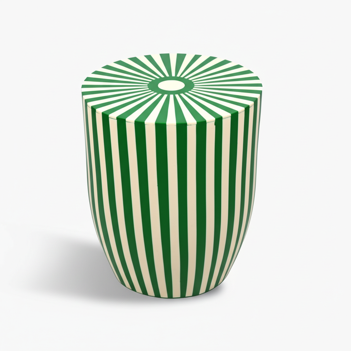 Green and white striped cylindrical stool on a white background