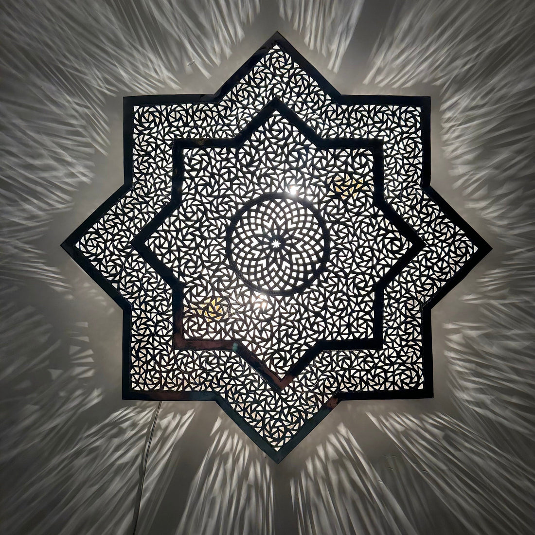 Handcrafted Moroccan brass sconce lighting with intricate patterns for warm and elegant decor