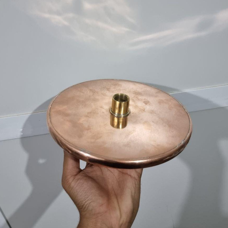 Luxurious copper rainfall shower head with wide spray for a spa-like bathroom upgrade