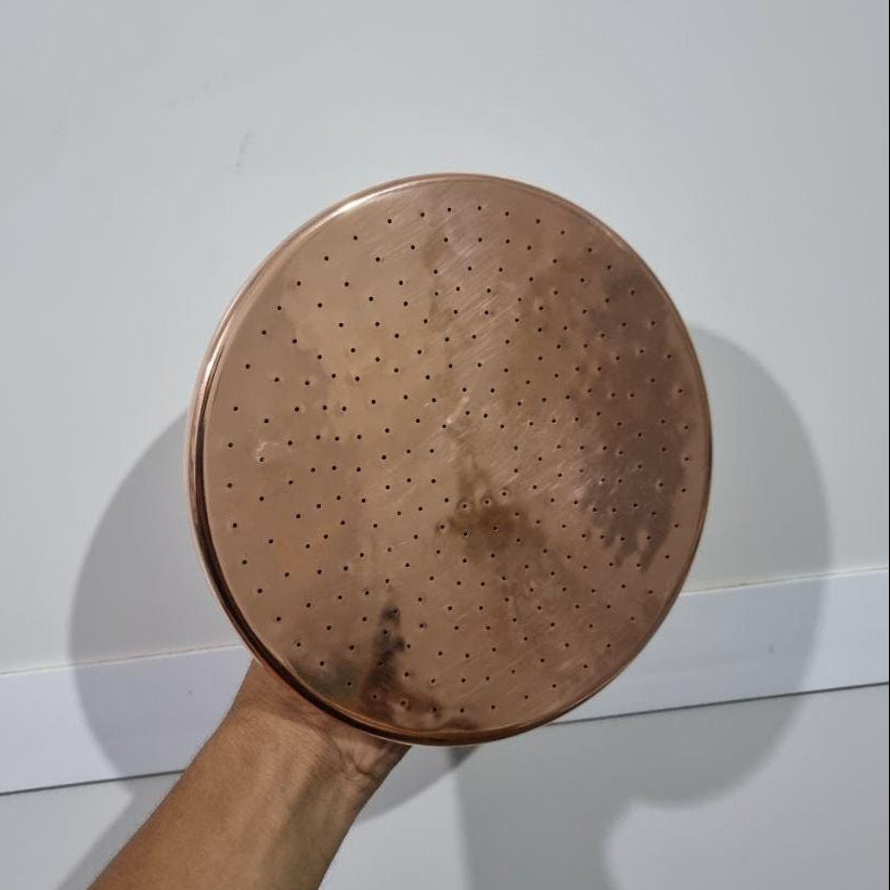 Luxurious copper rainfall shower head with wide spray for a spa-like bathroom upgrade
